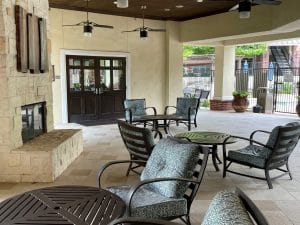 Three Bedroom Apartments in NW San Antonio, TX - Covered Outdoor Patio with Seating and Fireplace